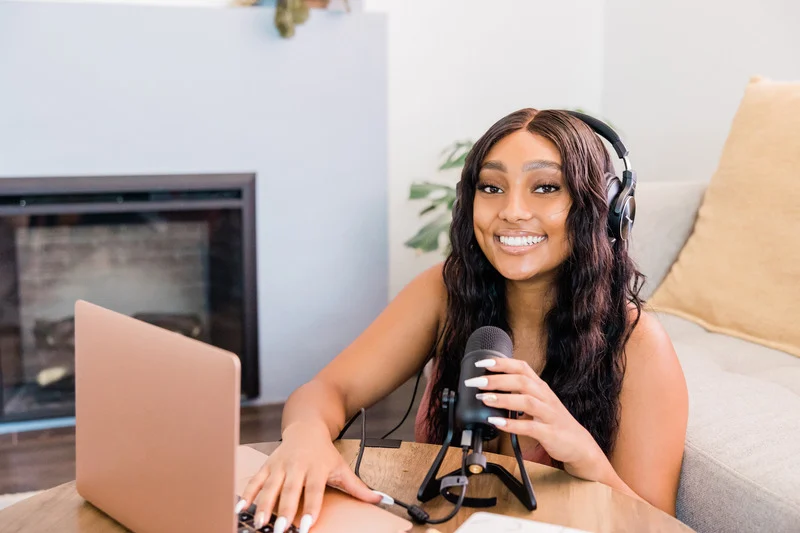 Young woman preparing to record a podcast